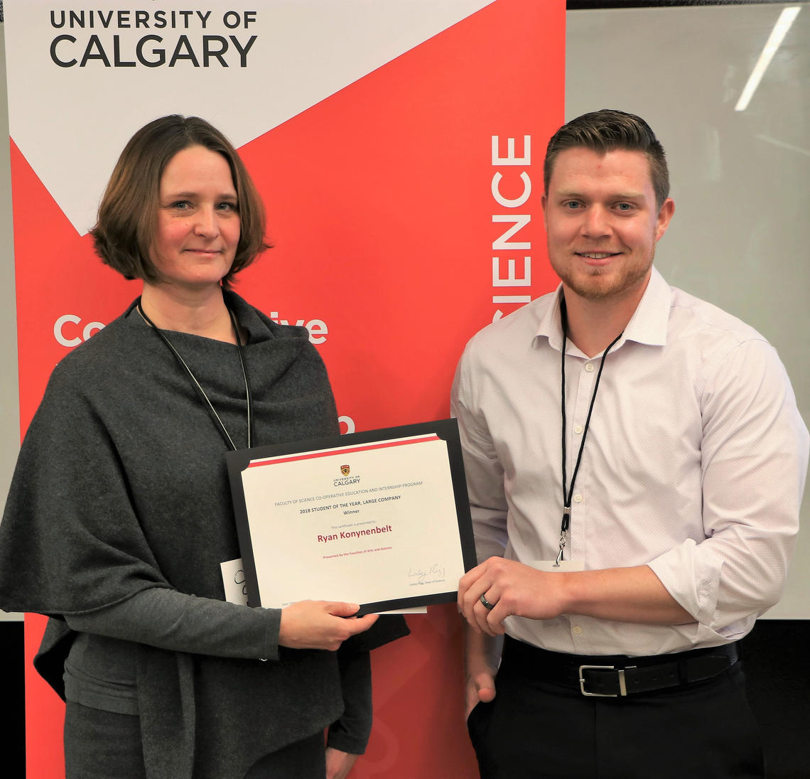 Cindy Graham, vice-dean of science, presents Ryan Konynenbelt with his certificate for winning Student of the Year working for a Large Company. Konynenbelt was nominated by his employer, Gerald LaRiviere, for the work done during his internship at TransCanada.