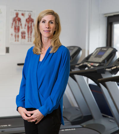 A triathlete who competes in Ironman competitions, Colleen Cuthbert is now researching the benefits of exercise for family caregivers of cancer patients. 