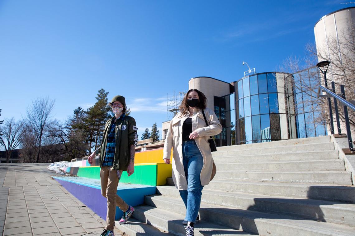 UCalgary students walk outside the MacEwan Student Centre on the university’s main campus.