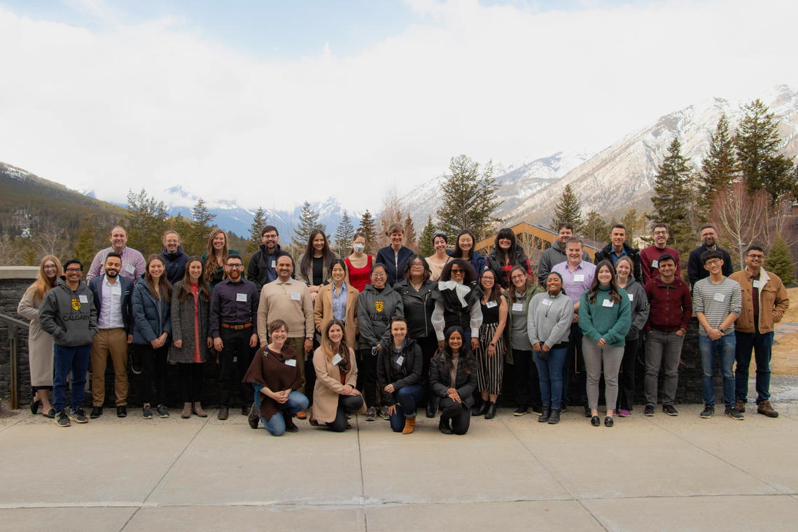 Group shot of members of the Graduate College with mountains in the background