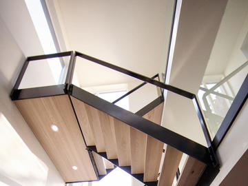 A light-filled stairwell in a Bioi Design + Build home in northeast Calgary.