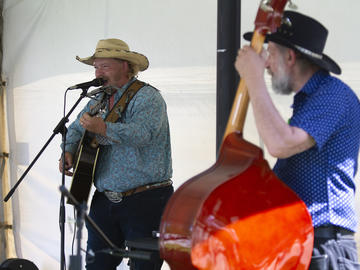 Jaydee Bixby and his band perform during the President's Stampede BBQ on July 12. 