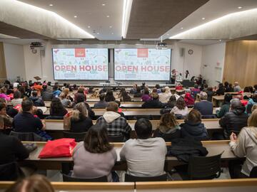 Open house attendees in lecture hall