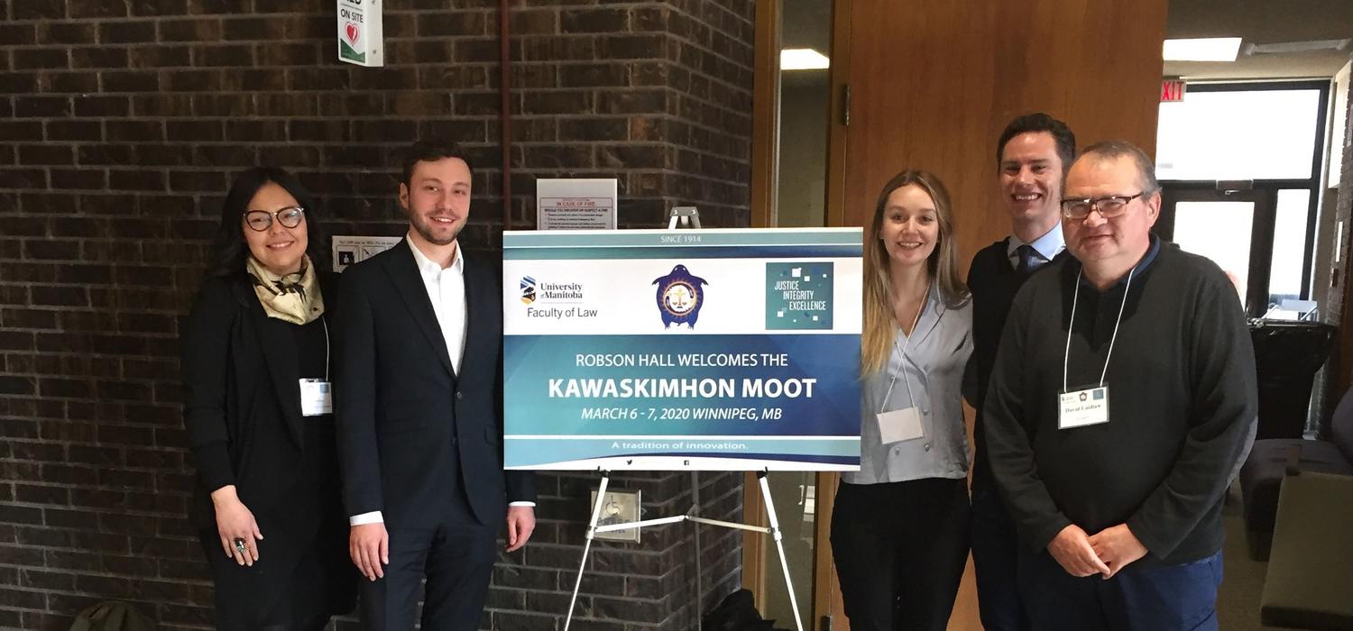 From left: Amelia Crowshoe, Aron Csaplaros, Erin Colwell, Eric Mosley, and coach David Laidlaw attend the Kawaskimhon Aboriginal Law Moot in Winnipeg.