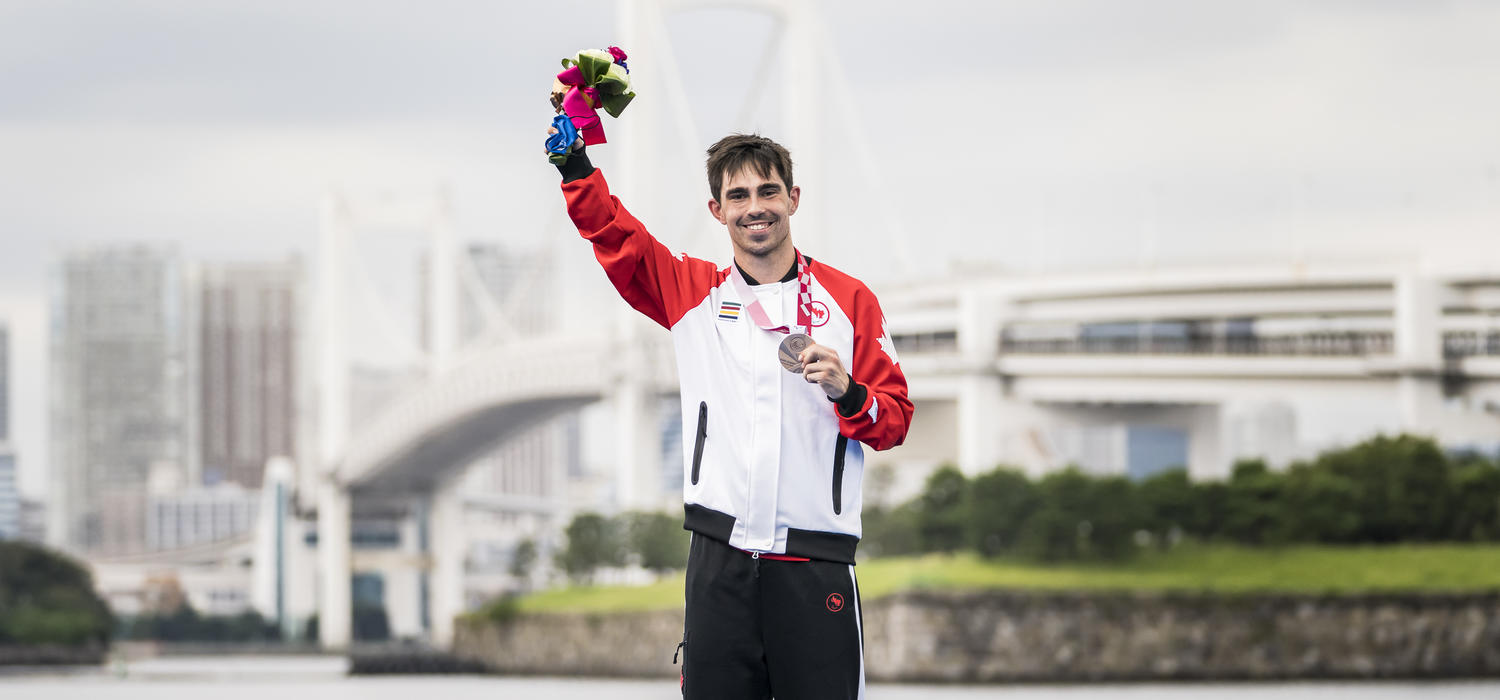 UCalgary student Stefan Daniel takes the podium after winning a bronze medal at the  men's paratriathlon in the 2020 Paralympic Games in Tokyo.