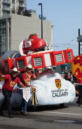 UCalgarys float being pushed through the Calgary Stampede Parade