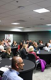 Audience in a meeting room at a Nursing Story Slam