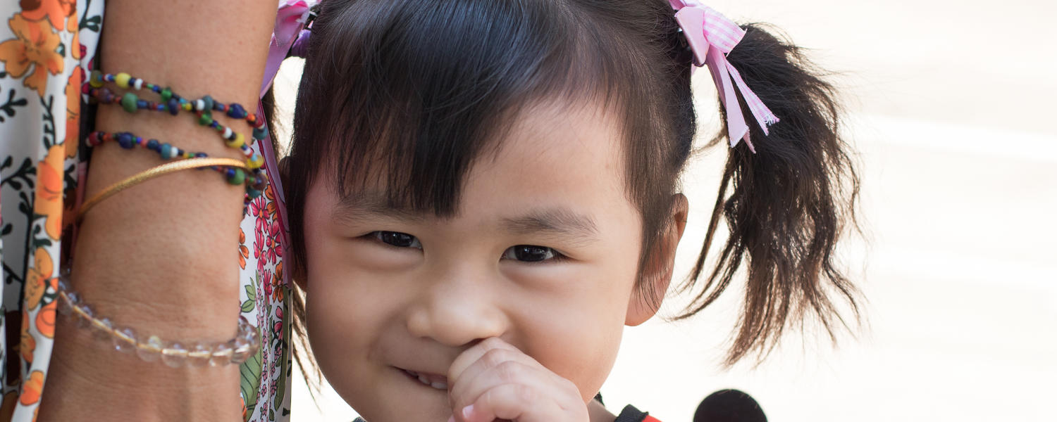 girl holding hand with mom