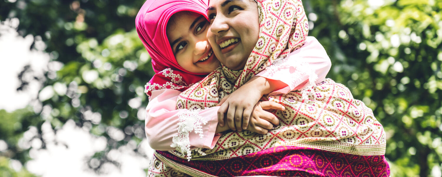 daughter holding on to mom