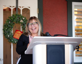 photo of Susan Graham speaking at Little Red Reading house event 